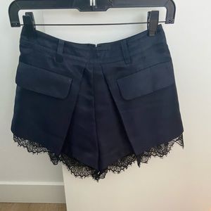 Self-portrait navy shorts w/ black lace trim. Sz 2